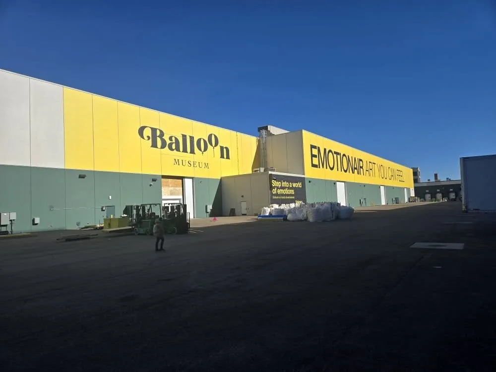 71,000 sqft Balloon Museum exterior wall wrap produced by Chicago Fleet Wraps convention graphics crew