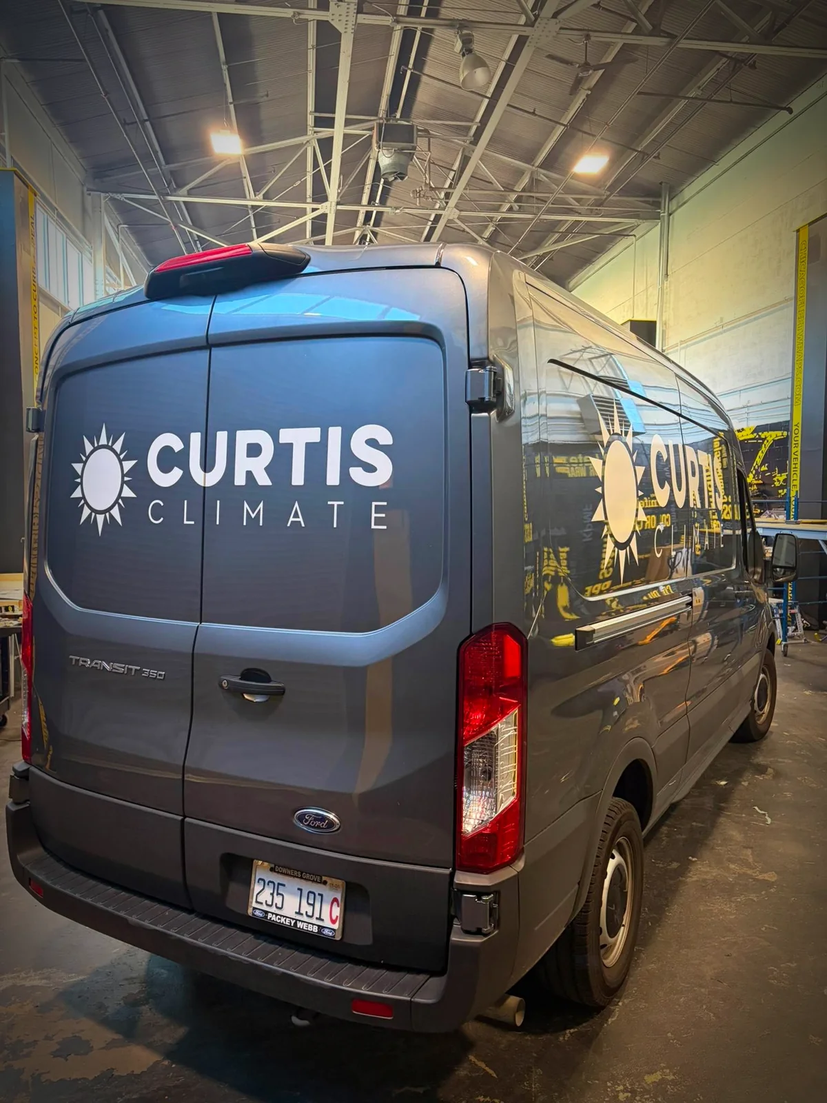 Curtis Climate van before rebrand, sun-logo lettering