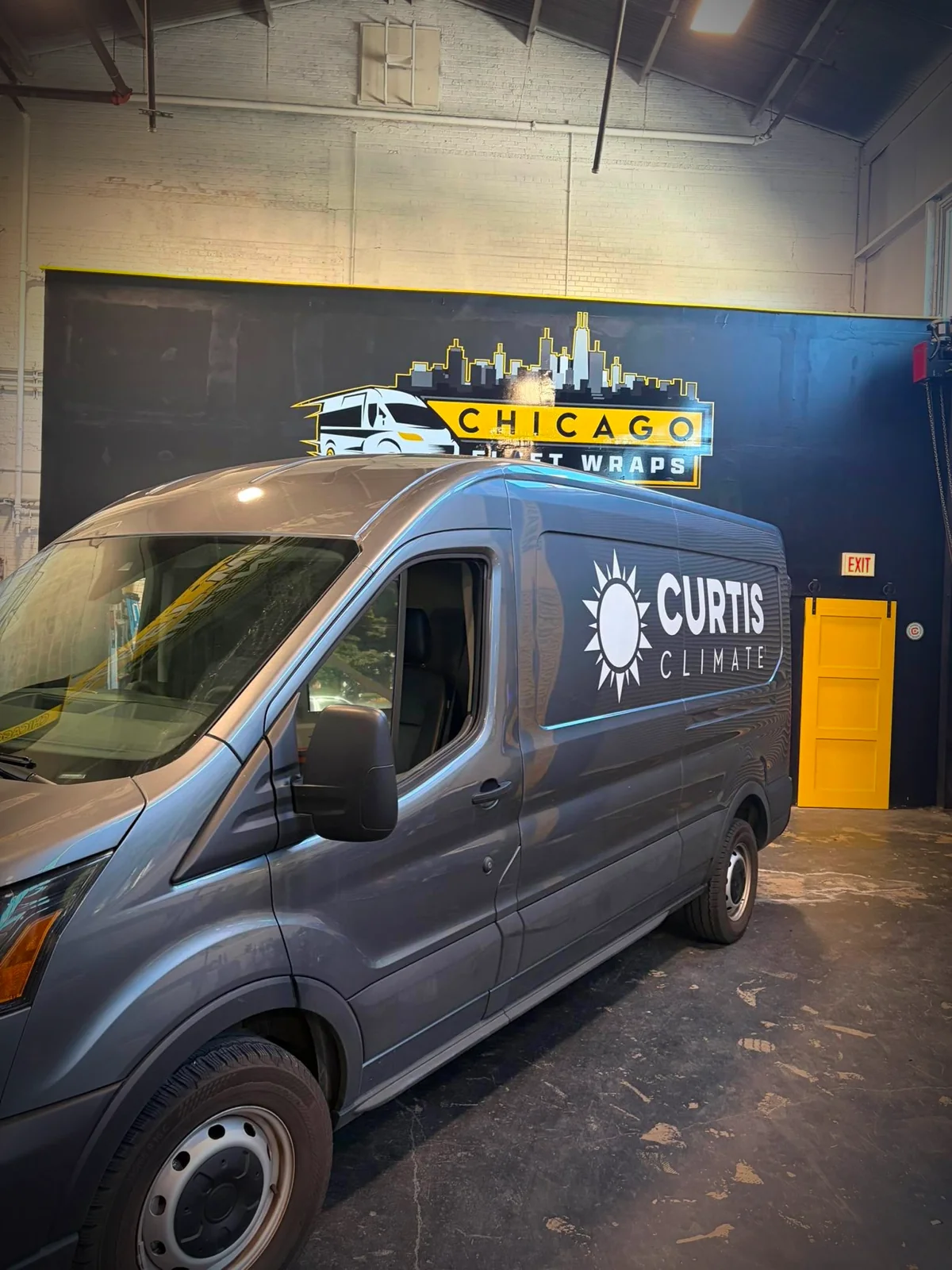 Curtis Climate van before, basic sun-logo cut-vinyl lettering on grey paint
