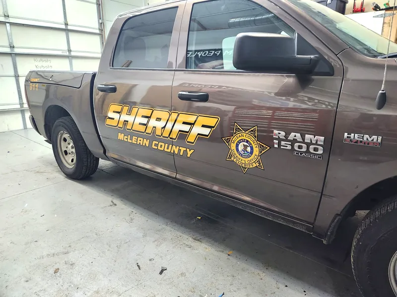 McLean County Sheriff RAM 1500 with reflective gold SHERIFF lettering and star seal