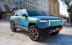 Rivian color change car wrap in holographic blue